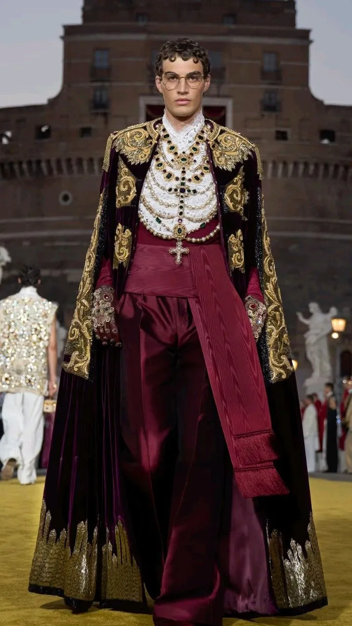 Baroque aesthetic — The rich velvet cape with gold embroidery, elaborate jewelry, and the overall regal presentation directly align with the description of 17th-century European court drama and excess.