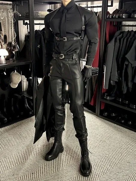 Bondage aesthetic — Full leather outfit with harness, buckles, and straps, embodying the visual signature of Bondage Fashion.