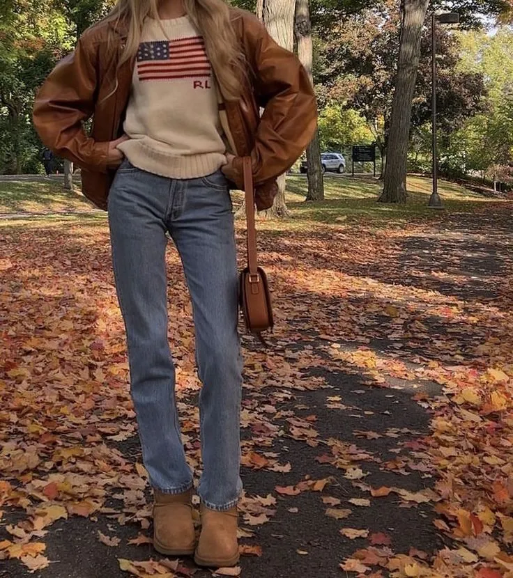 Cinnamon Girl aesthetic — Leather jacket, vintage-style sweater, slouchy jeans, brown boots, and a satchel perfectly capture the autumn cosy, vintage, and Lana-coded elements.