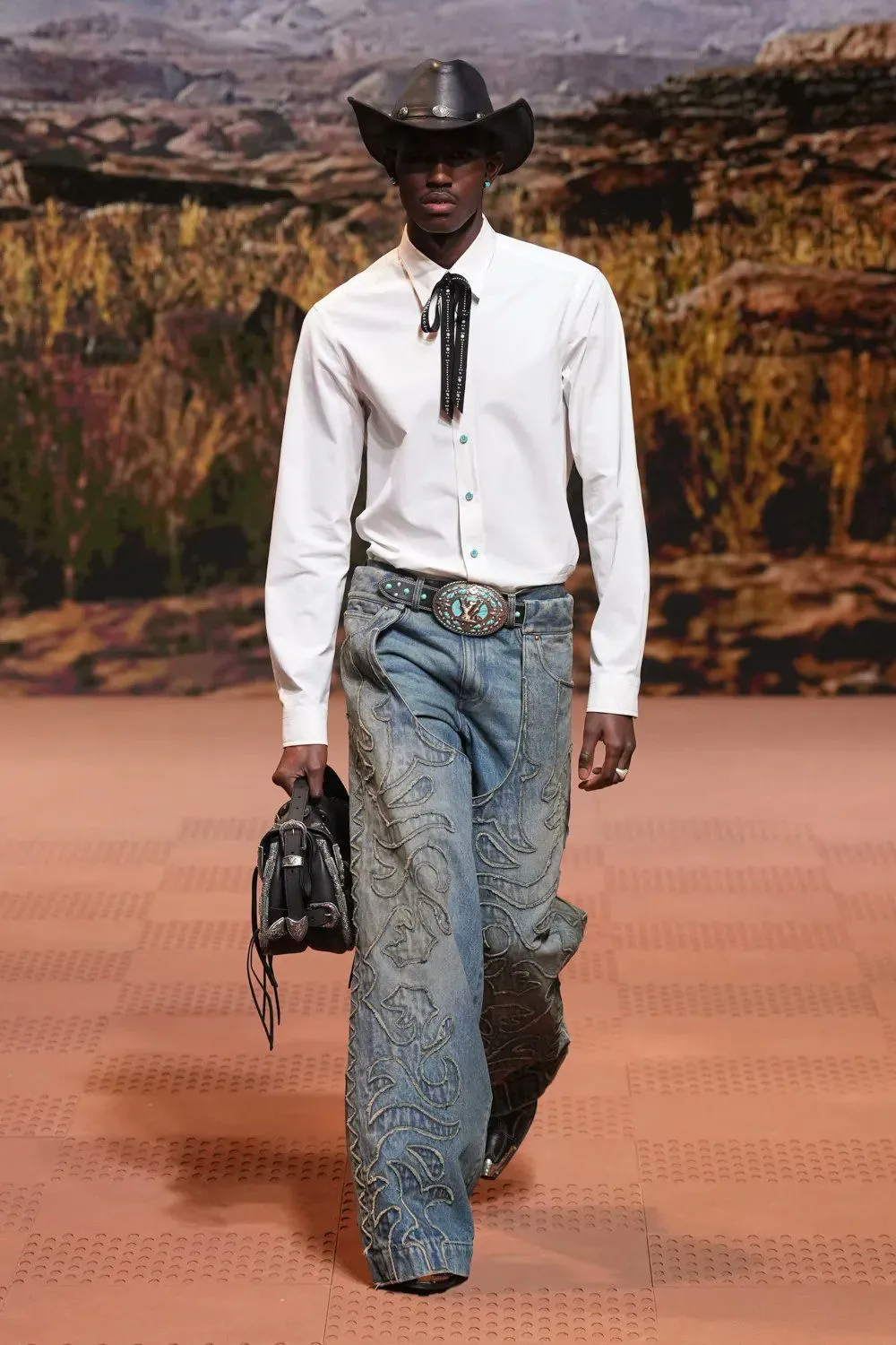 Cowboycore aesthetic — Denim-on-denim 'cowboy tuxedo' with intricate embroidery and a concho belt are perfect examples of the aesthetic.