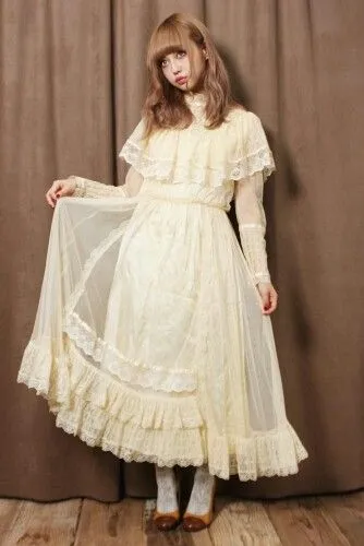 Cult Party Kei aesthetic — This image is a perfect representation with its full lace dress, layered slips, and vintage feel, embodying the ghost-bride mood.