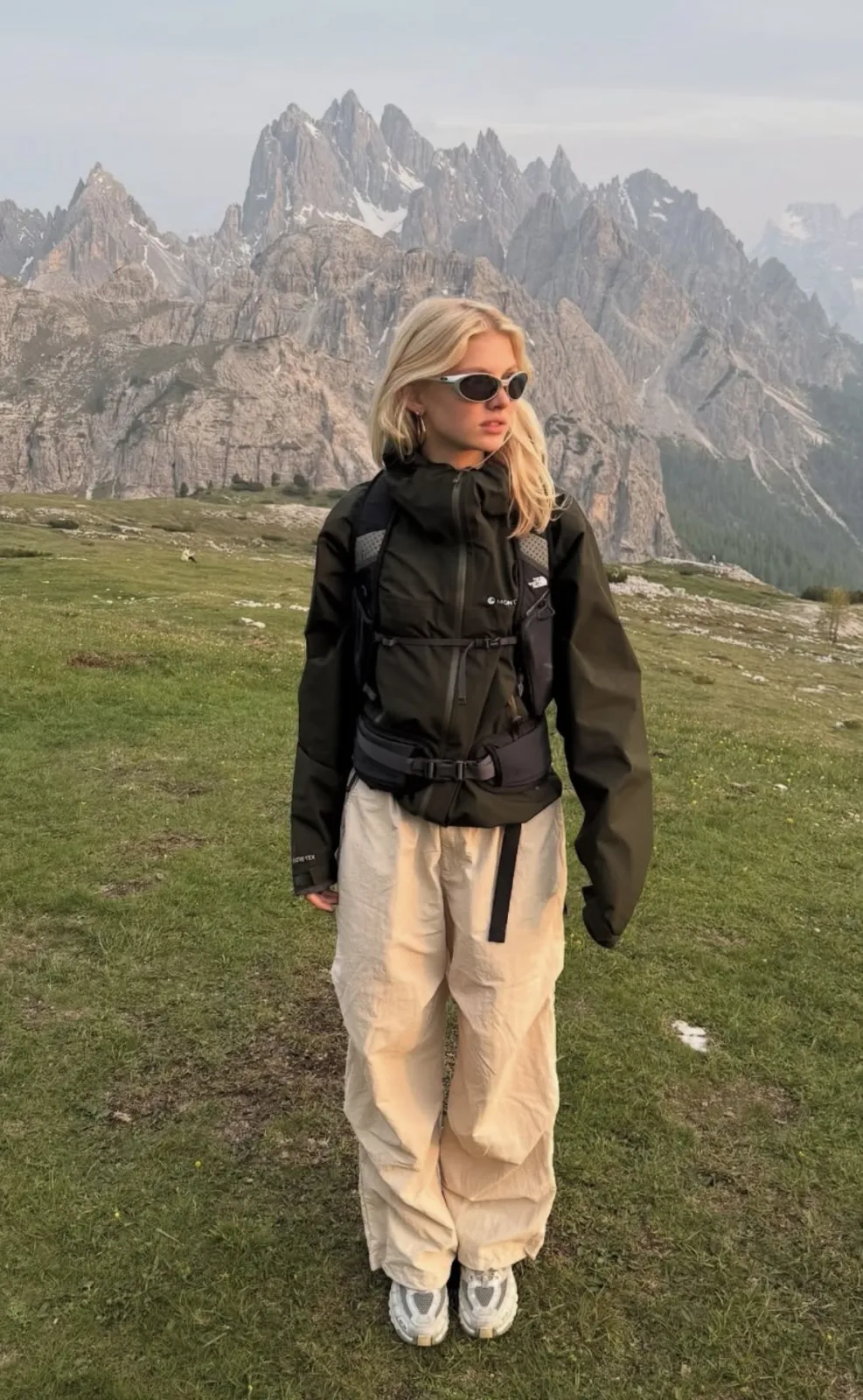 Gorpcore aesthetic — Perfectly captures Gorpcore with a technical Arc'teryx jacket, hiking pants, trail runner footwear, and a backpack in a mountainous outdoor setting, aligning with the aesthetic's origins and visual signature.