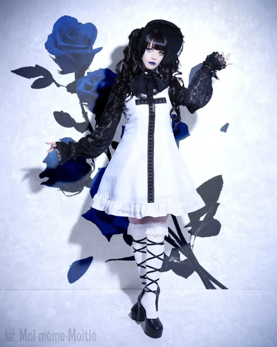 Gothic Lolita aesthetic — Showcases a white dress with black lace, cross motif, and lace knee-high socks, with Moi-même-Moitié branding, hitting key visual elements.