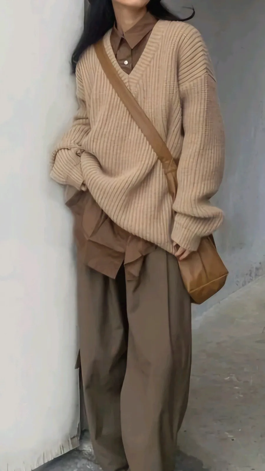 Korean Cozy Beige aesthetic — Excellent tonal layering of beige knitwear over a brown shirt with matching trousers and a crossbody bag, embodying the relaxed-warm K-minimalist style.
