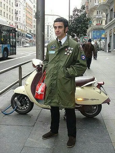 Mod Revival aesthetic — Fishtail parka with stenciled patches, scooter, and overall attitude are perfect Mod Revival.