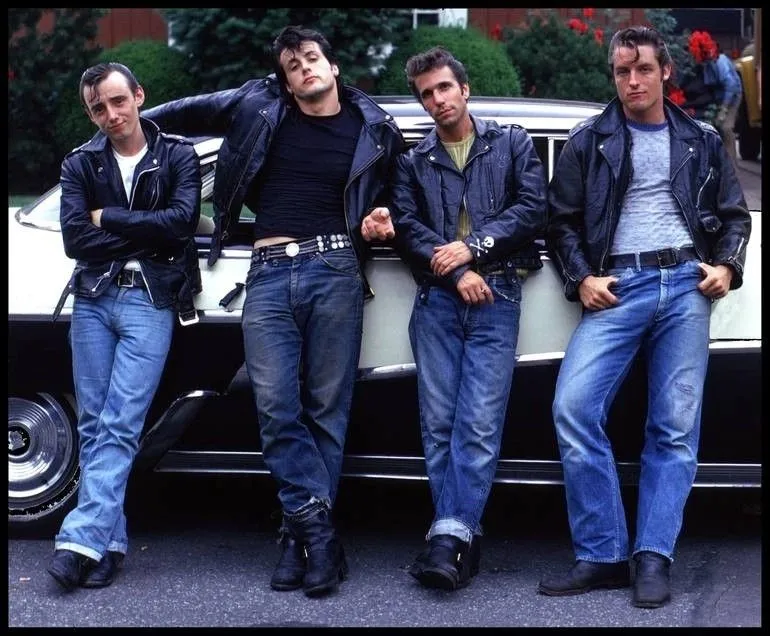 Raggare aesthetic — This image perfectly captures the Raggare aesthetic with the pomaded hair, leather jackets, white tees, cuffed Levi's, and the vintage American car backdrop.