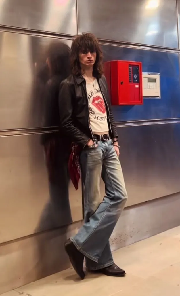 Rockers aesthetic — This image perfectly captures the Rocker aesthetic with the black leather jacket, white tee (with a band logo implied), slim jeans, silk neckerchief, and the overall mood.