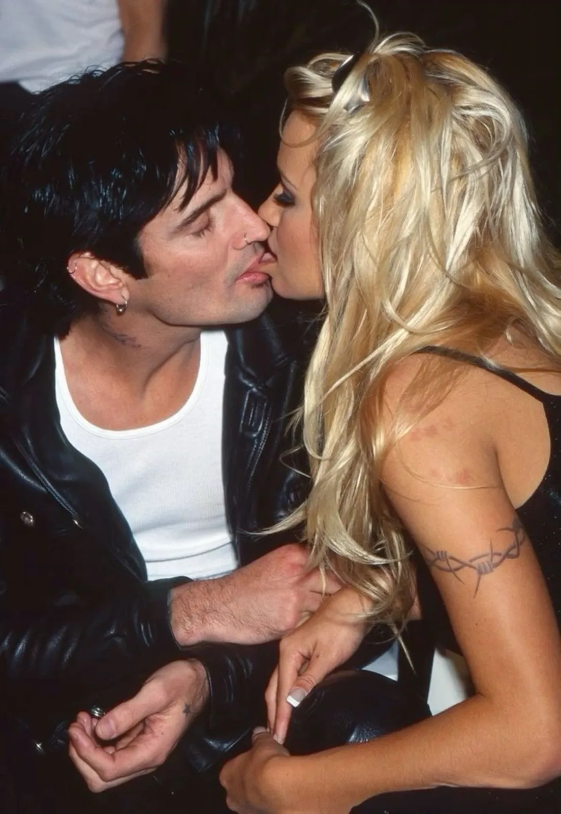 Rockstar Girlfriend aesthetic — This image directly references Pamela Anderson and Tommy Lee, key figures in the 90s rockstar culture touchstone.