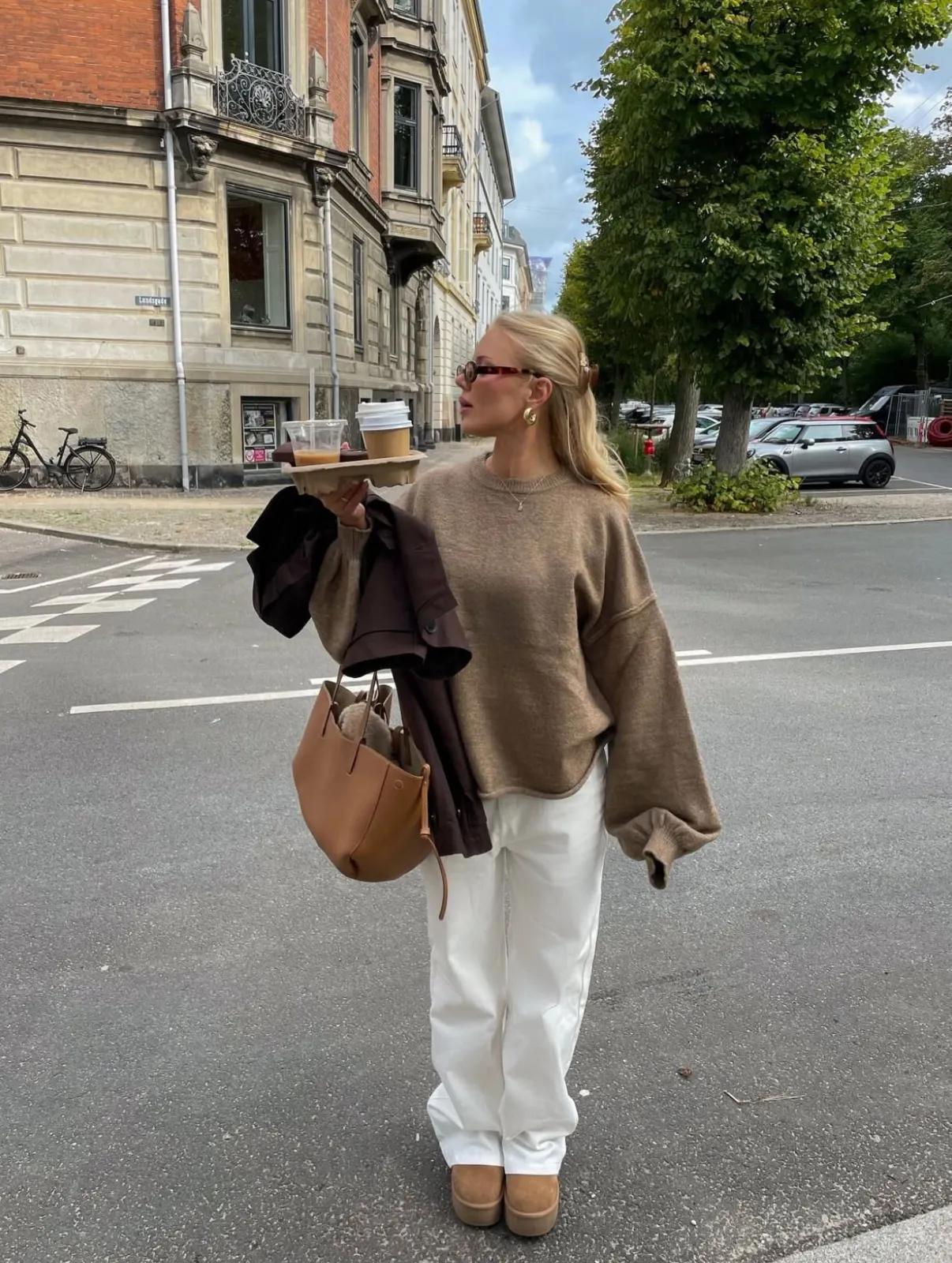 Scandi Girl Winter aesthetic — Oversized knit, wide-leg white trousers, and shearling-style clogs perfectly capture the hygge-coded Nordic winter aesthetic described.