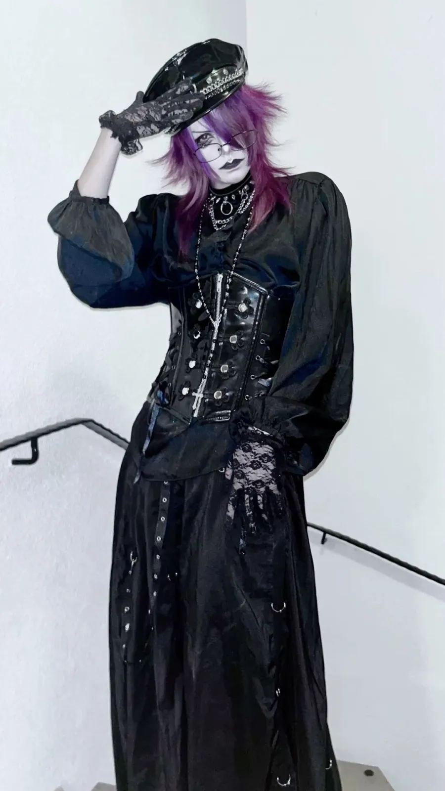 Visual Kei aesthetic — Corsetry, lace, heavy makeup, and dark palette directly reference the gothic-aristocrat substyle and visual signature.