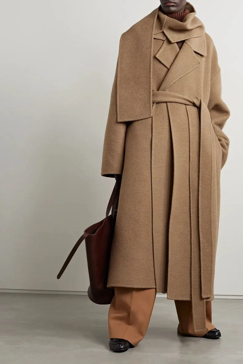 Winter Aesthetic aesthetic — Belted wool coat, layered knit, scarf, and neutral palette perfectly capture the cozy countryside winter vibe.