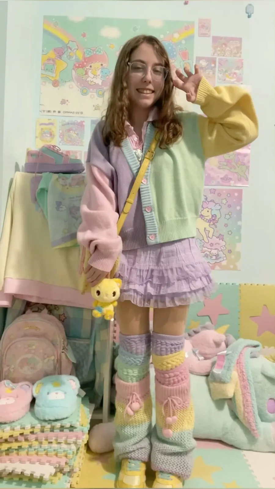 Yume Kawaii aesthetic — The pastel color-blocked cardigan, rainbow pastel gradient leg warmers, and the overall dreamy, childlike layering strongly align with Yume Kawaii.
